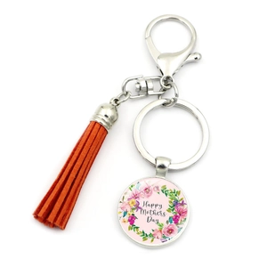 Detail of Happy Mothers Day keychain with orange tassel and pink floral glass pendant