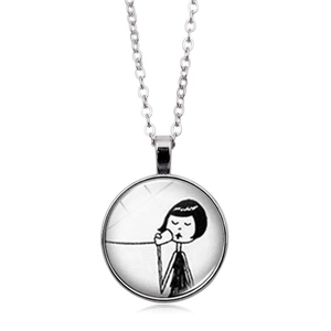 Artistic silver chain necklace with a circular black and white girl illustration pendant