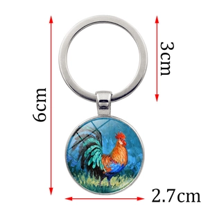 Porte-clés artistique avec peinture d'un coq et dimensions précises de 6cm de longueur