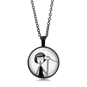 Detail of round black pendant necklace with minimalist hand-drawn girl illustration