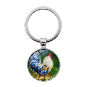 Détail du porte-clés peinture à l'huile de coq avec finition en verre cabochon poli