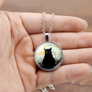 Vintage luminous necklace with black cat and moon glass pendant on silver chain