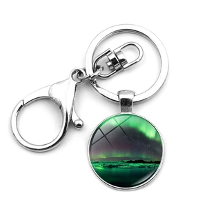Detailed view of Aurora Borealis glass cabochon pendant with silver lobster clasp and ring