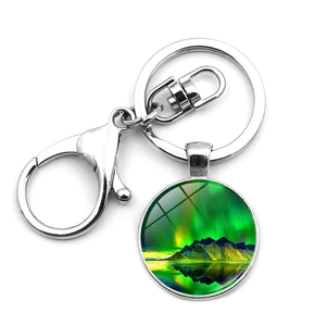 Detail of silver alloy keychain with glass aurora landscape pendant and lobster clasp