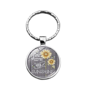 Porte-clés tournesol dôme en verre avec texte You Are My Sunshine en métal argenté