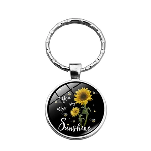 Porte-clés tournesol avec dôme en verre et citation artistique You are my Sunshine