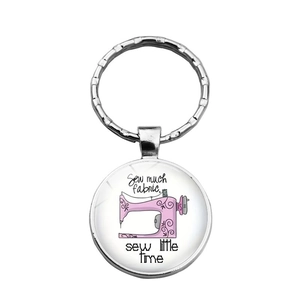 Vintage silver keychain with sewing machine glass dome and 'Sew much fabric' quote