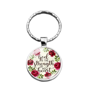 Silver metal keychain with red rose design and God is the Strength religious quote charm