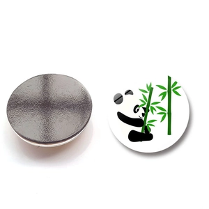 Detail of round panda fridge magnet showing the cartoon print and strong magnetic backing
