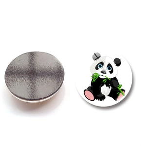 Detail of round panda fridge magnet showing cartoon front and magnetic back side