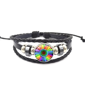 Multilayer leather bracelet featuring a vibrant sunflower glass charm and braided ropes