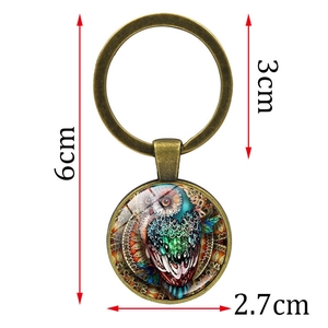Artistic owl keychain with glass gem and bronze metal frame, overall length 6cm