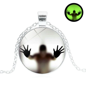 Luminous Halloween glass pendant necklace with glowing ghost silhouette on silver chain