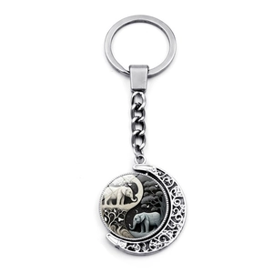 Rotating keychain with Yin Yang elephant and moon pendant in polished metal finish