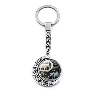 Rotating elephant Yin Yang pendant keychain in silver metal with moon frame
