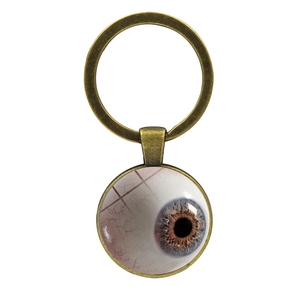 Porte-clés bronze vintage avec motif œil réaliste sous cabochon en verre bombé