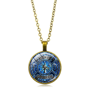 Detailed macro of vintage bronze firefighter emblem pendant with fire station symbols