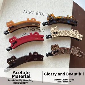 Detailed view of high-quality acetate cat banana hair clips in multi-colored patterns