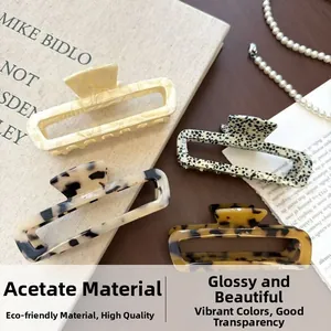 Detailed set of four rectangular acetate hair claws in various elegant vintage colors