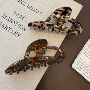 Set of large acetate hair claws with hollow heart design and classic tortoiseshell patterns