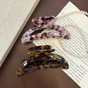 Elegant tortoiseshell and purple marble acetate hair claws for women, semi-circle design