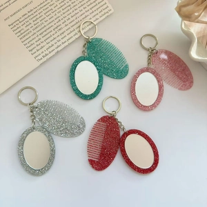 Glitter comb and mirror keychain set in four vibrant colors with a silver metal ring