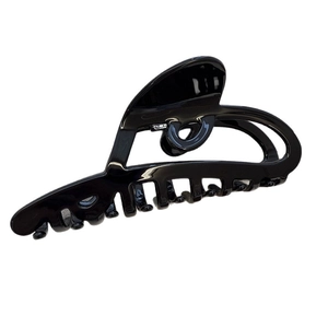 Minimalist glossy black acetate hair claw clip with hollow heart design on white background