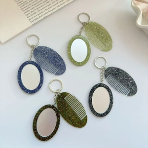 Glitter comb and mirror keychain set in blue, green, and black for bags and cars