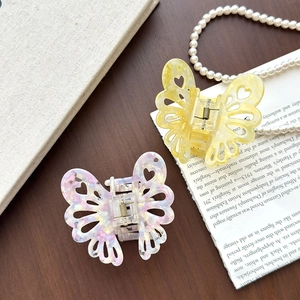 Pinces à cheveux papillon en acétate, coloris jaune marbré et blanc violet irisé