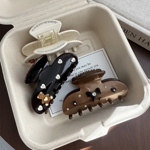 Lot de trois pinces à cheveux en crème, noir et marron avec ours et nœuds mignons