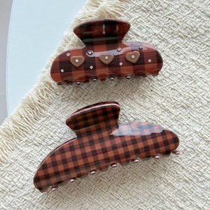 Vintage cocoa brown checkered hair claws with heart rhinestones on woven fabric
