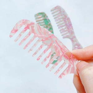 Three colorful acetate wide tooth combs with marble pattern for hair styling