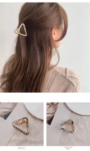 Detail of triangular acetate hair claws in tortoise shell, grid, and blue floral patterns