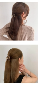 Close-up of acetic acid triangle hair claw clip on elegant half-up hairstyle