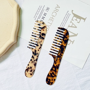 Set of two tortoise shell acetate hair combs with ergonomic handles for styling