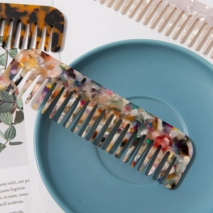 Elegant acetate wide-tooth hair comb with marble texture for detangling curly hair