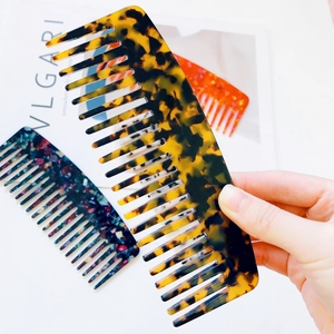Acetate wide-tooth hair comb set featuring tortoise shell and colorful marble patterns