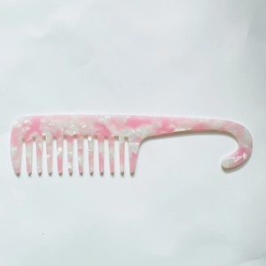 Pink and white marble wide-tooth comb with functional hook handle for wet or curly hair