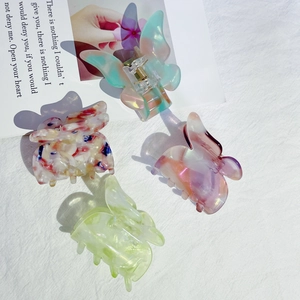 Pinces à cheveux papillon élégantes en acétate avec motifs marbrés et floraux
