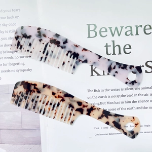 Minimalist acetate hair comb set with marble and tortoiseshell patterns with wide teeth