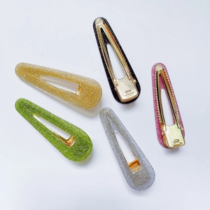 Set di cinque fermagli per capelli glitterati in oro, nero, verde, argento e rosa