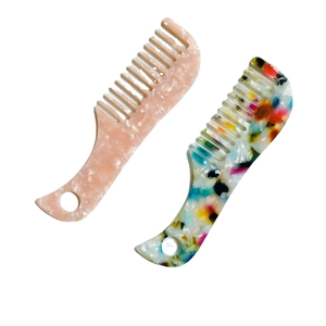 Mini acetate wide-tooth hair comb set in pink marble and floral tortoiseshell patterns