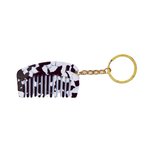 Mini acetaat kam sleutelhanger met zwart-wit marmerpatroon en gouden metalen ring