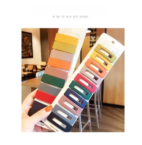 Matte finish rectangular hair clips in assorted Morandi colors on a display card