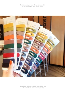 Close-up of matte colorful hair clip set including barrette and water drop shapes