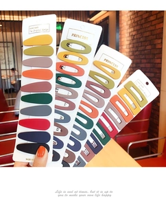 Detailed macro view of matte Morandi colored geometric metal hair clips for women