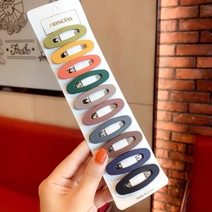 Set of 10 matte oval BB hair clips in Morandi colors displayed on card holder