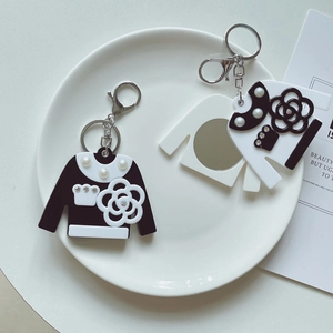 Portable acrylic keychain mirror set with vintage camellia pattern in black and white