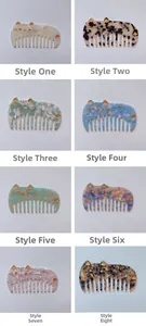 Cat-shaped acetate wide-tooth hair combs in various marble and tortoiseshell patterns