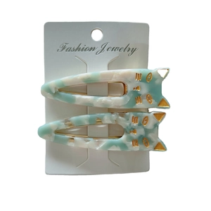 Cute acetate cat hair clips with marble texture and gold metallic details on white card